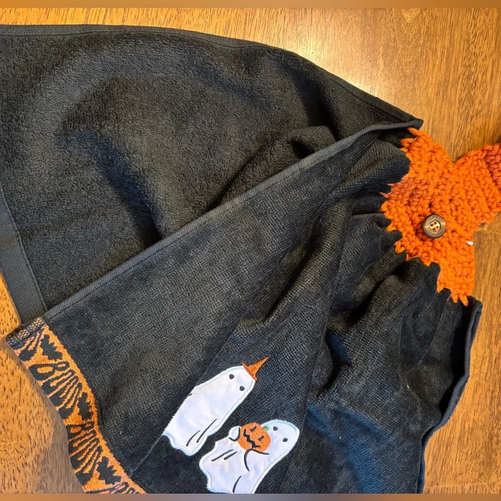 Hand crocheted full towel with embroidered ghosts